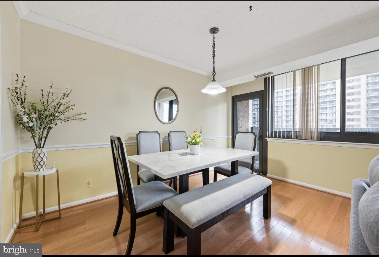 5501 Seminary Road, Unit 801S Falls Church, VA 22041 - Photo 7 of 32 a view of a dining room with furniture window and wooden floor