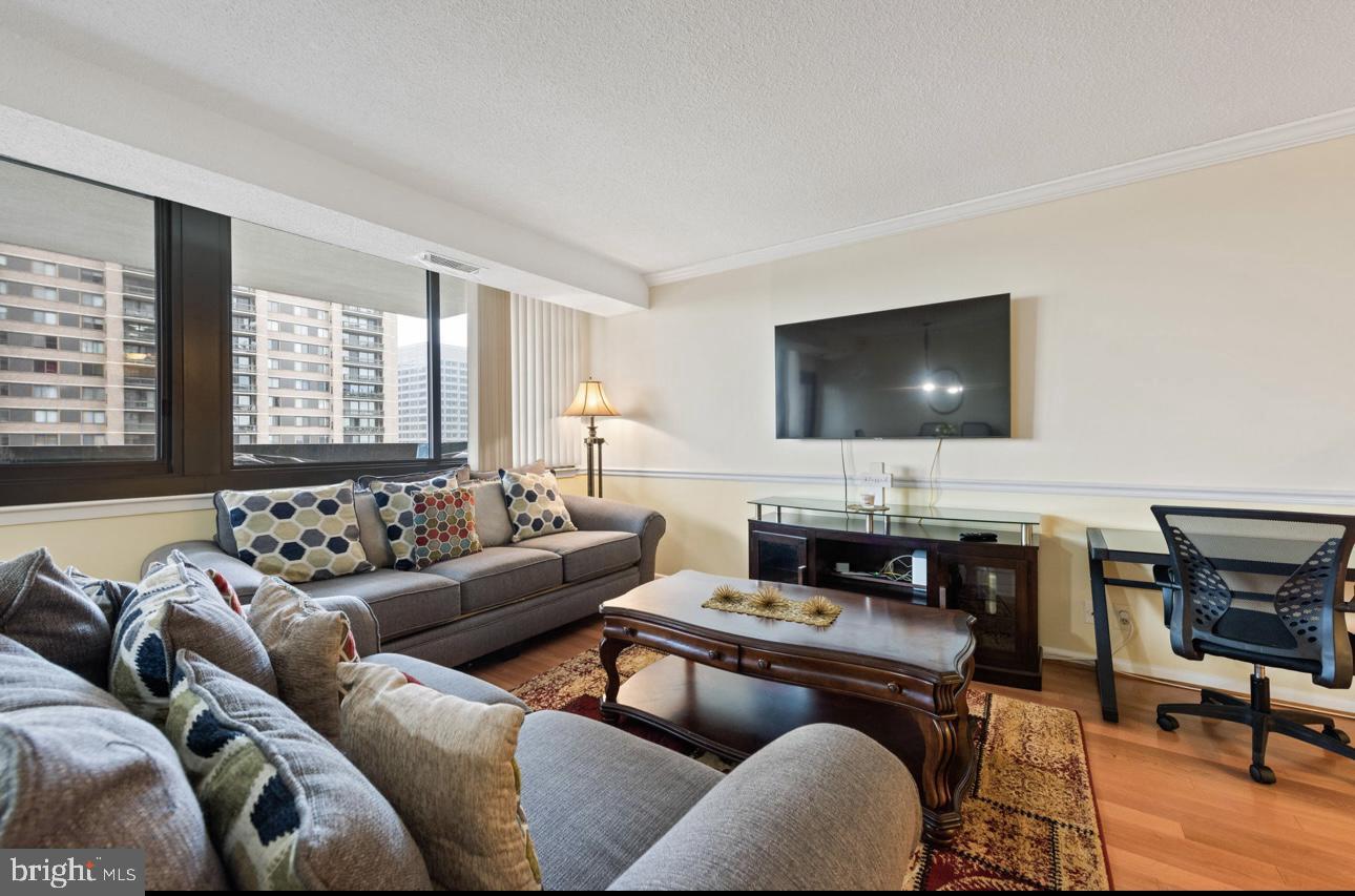 5501 Seminary Road, Unit 801S Falls Church, VA 22041 - Photo 9 of 32 a living room with furniture and a flat screen tv