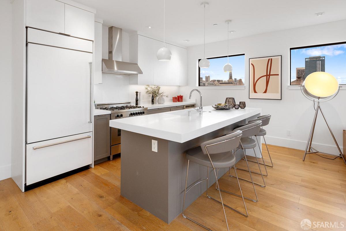 564 Fell Street San Francisco, CA 94102 - Photo 14 of 82 a kitchen with a sink a stove a refrigerator and white cabinets