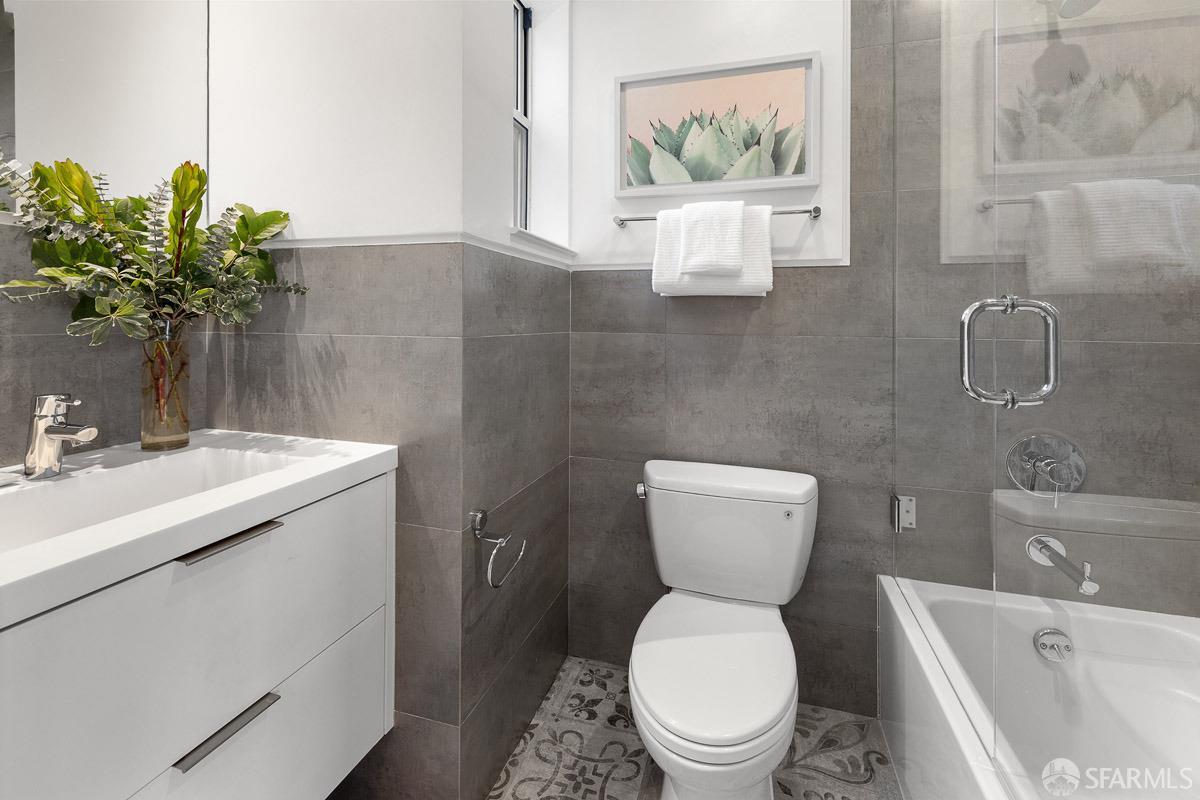 564 Fell Street San Francisco, CA 94102 - Photo 25 of 82 a bathroom with a toilet sink and mirror