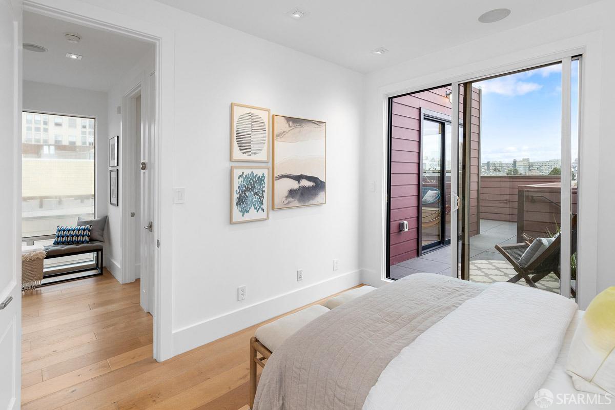 564 Fell Street San Francisco, CA 94102 - Photo 35 of 82 a bedroom with a bed and a large mirror