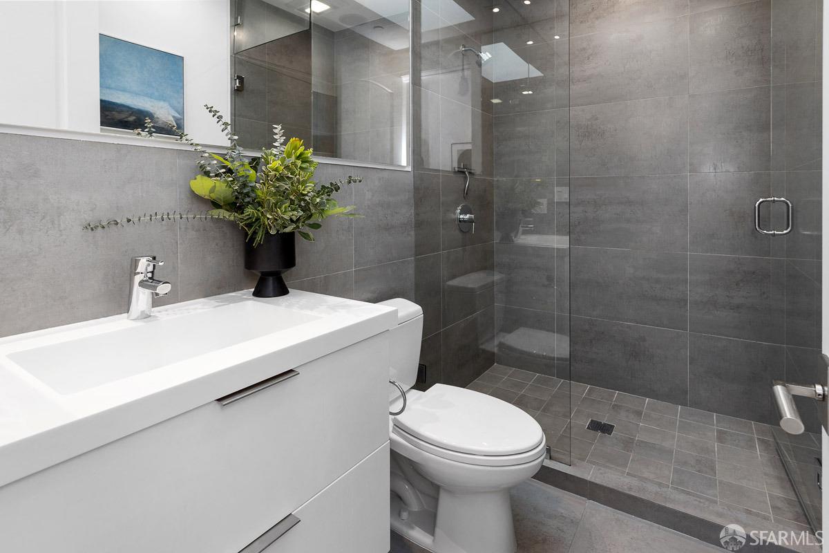 564 Fell Street San Francisco, CA 94102 - Photo 40 of 82 a bathroom with a sink a toilet and shower