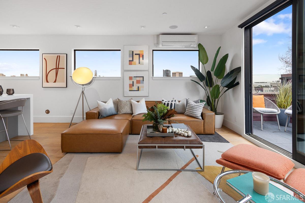 564 Fell Street San Francisco, CA 94102 - Photo 8 of 82 a living room with furniture potted plant and a large window