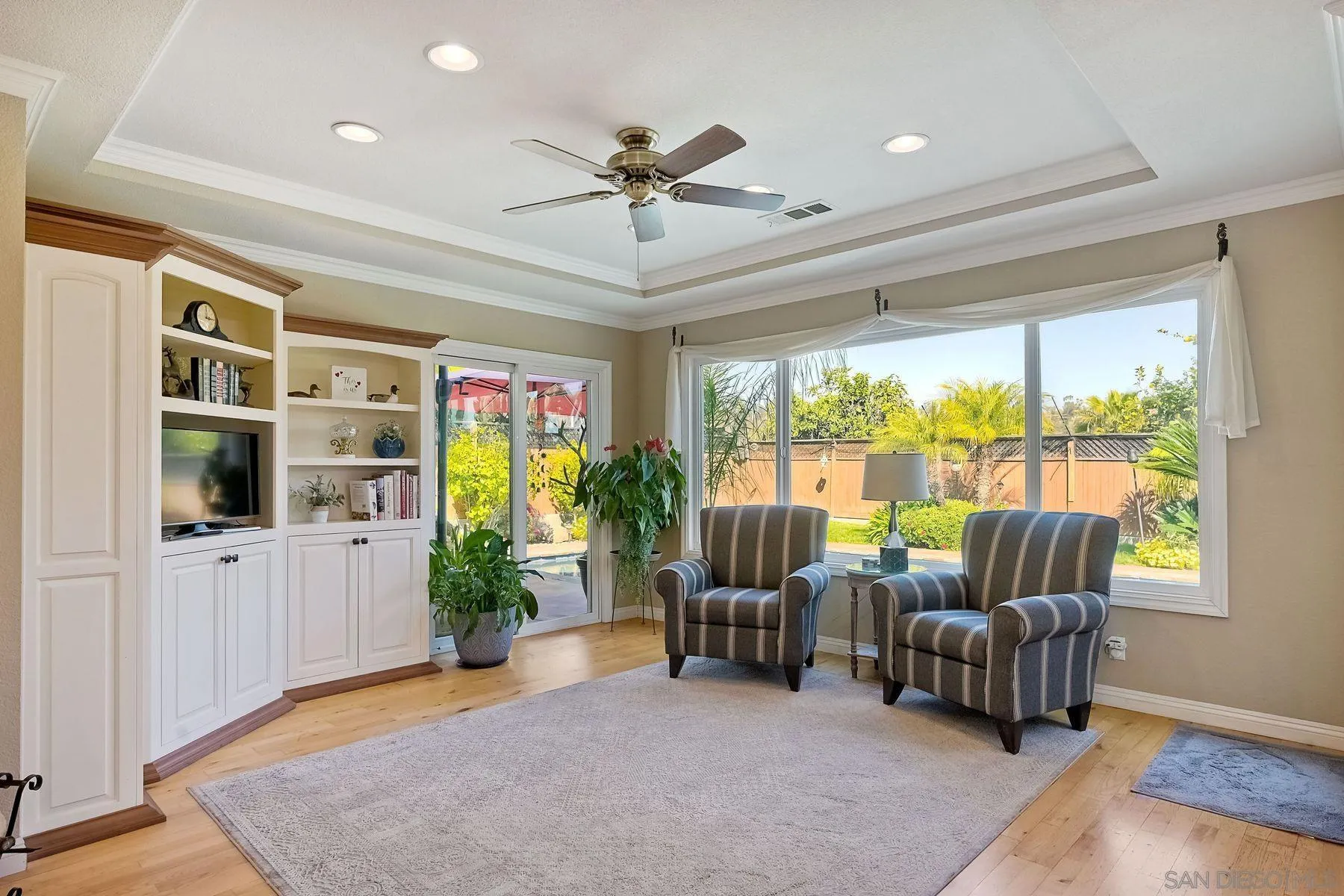 13821 Eisenhower Avenue Poway, CA 92064 - Photo 12 of 37 a living room with furniture and a floor to ceiling window
