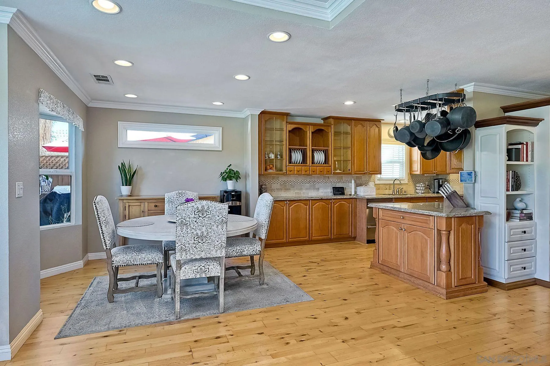 13821 Eisenhower Avenue Poway, CA 92064 - Photo 13 of 37 a view of a kitchen and dining room