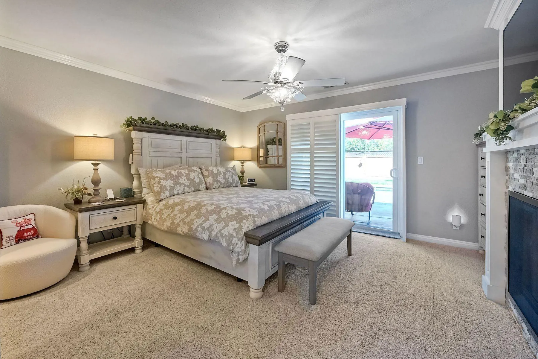 13821 Eisenhower Avenue Poway, CA 92064 - Photo 18 of 37 a bedroom with a bed and a chandelier