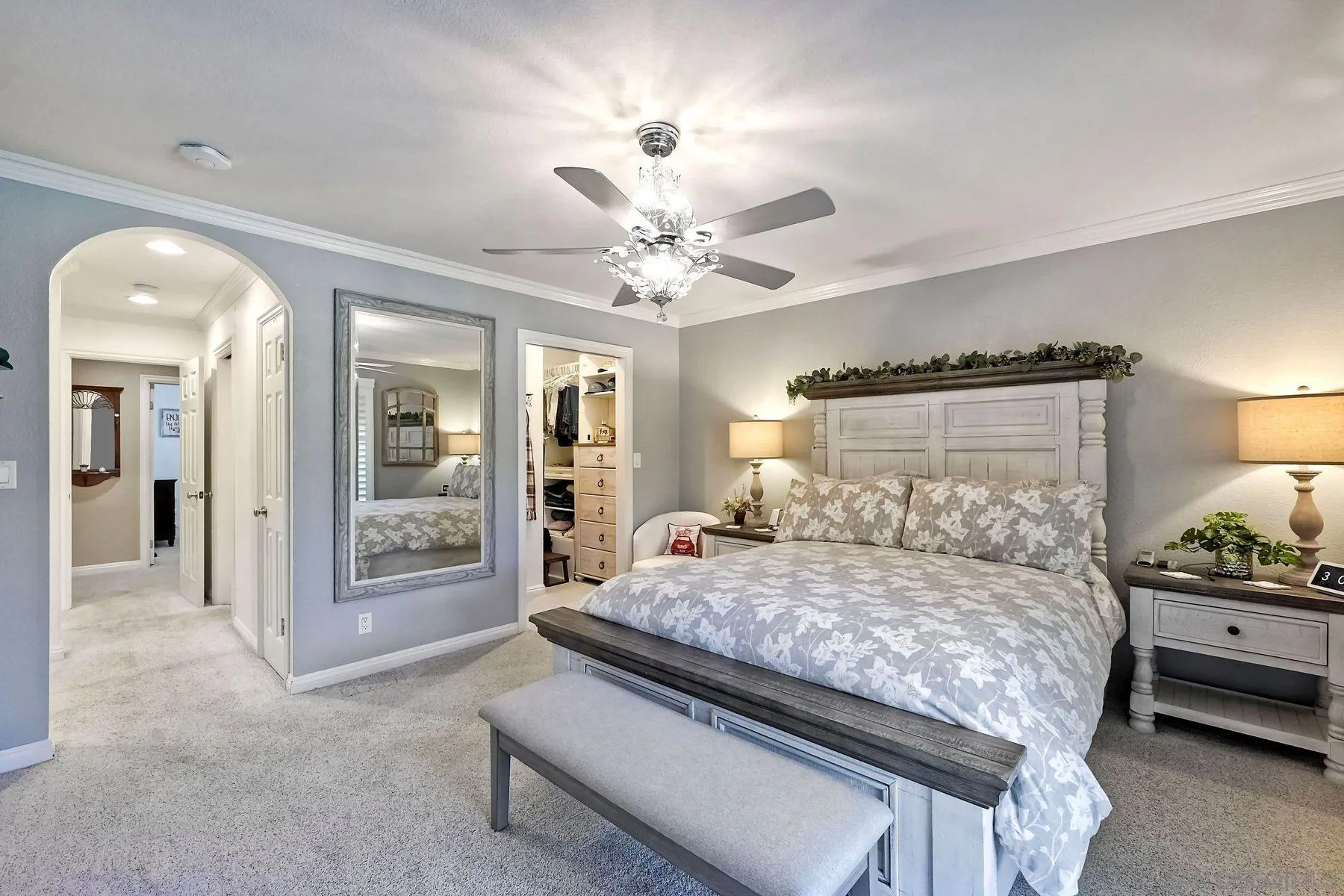 13821 Eisenhower Avenue Poway, CA 92064 - Photo 19 of 37 a bedroom with a balcony a bed and a chandelier