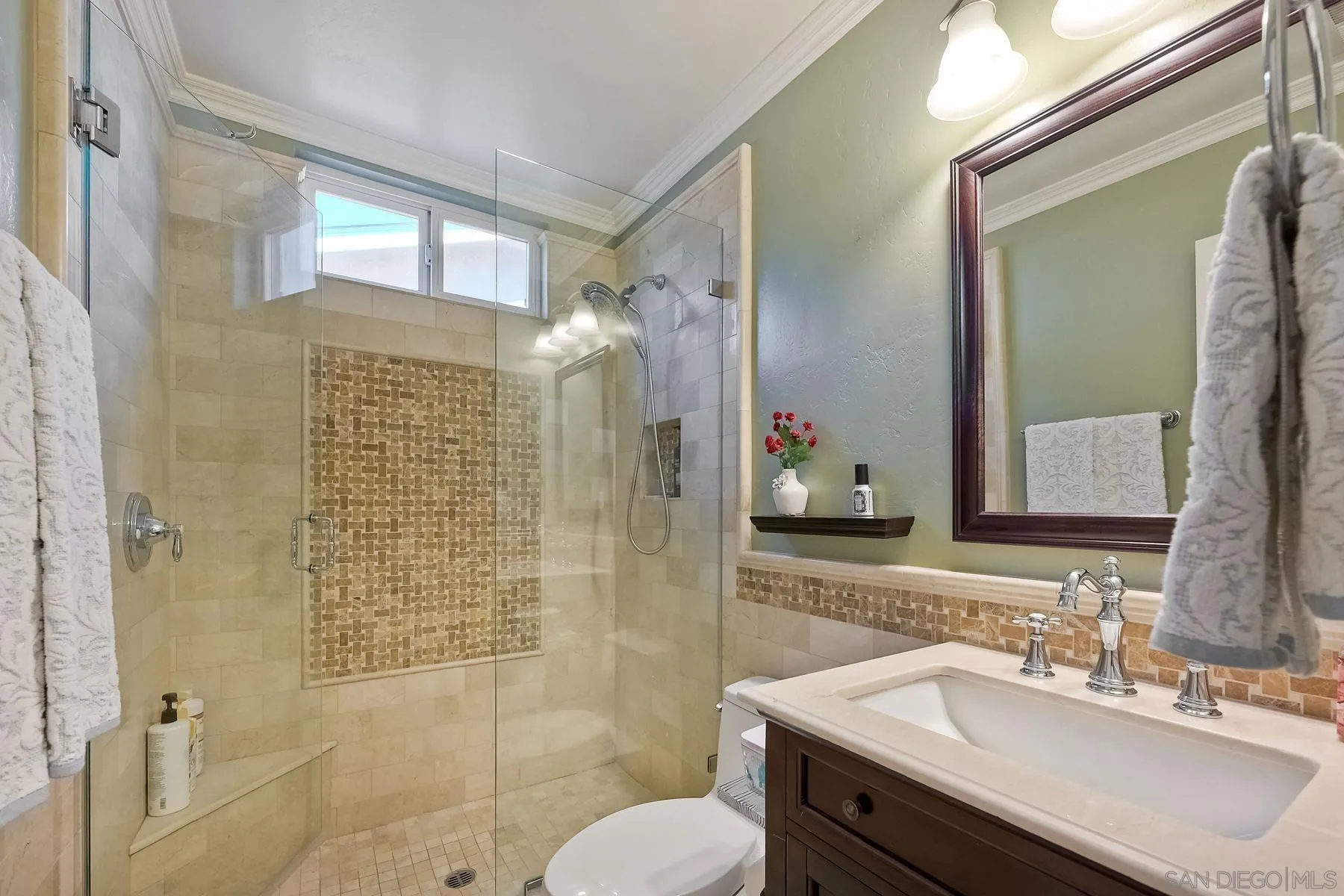 13821 Eisenhower Avenue Poway, CA 92064 - Photo 24 of 37 a bathroom with a sink vanity mirror and shower
