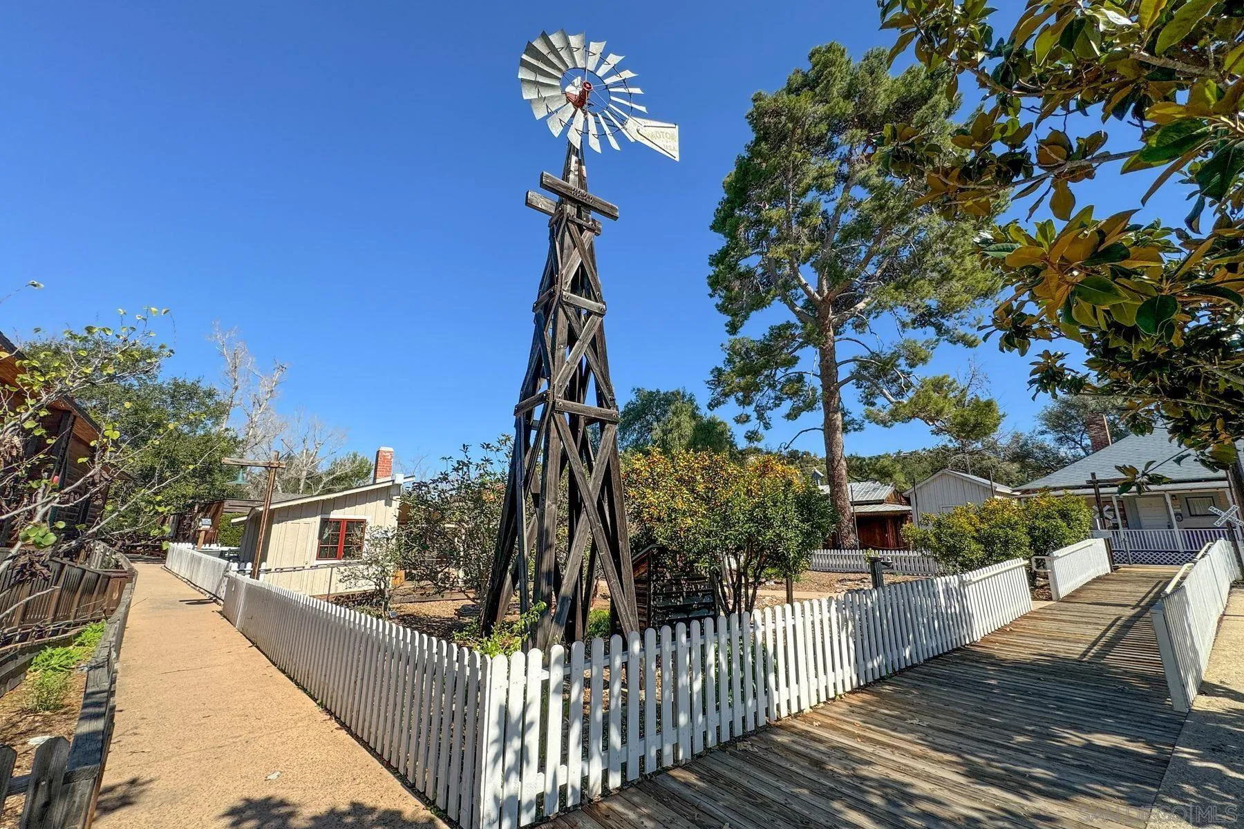 13821 Eisenhower Avenue Poway, CA 92064 - Photo 32 of 37 a view of a house with wooden fence