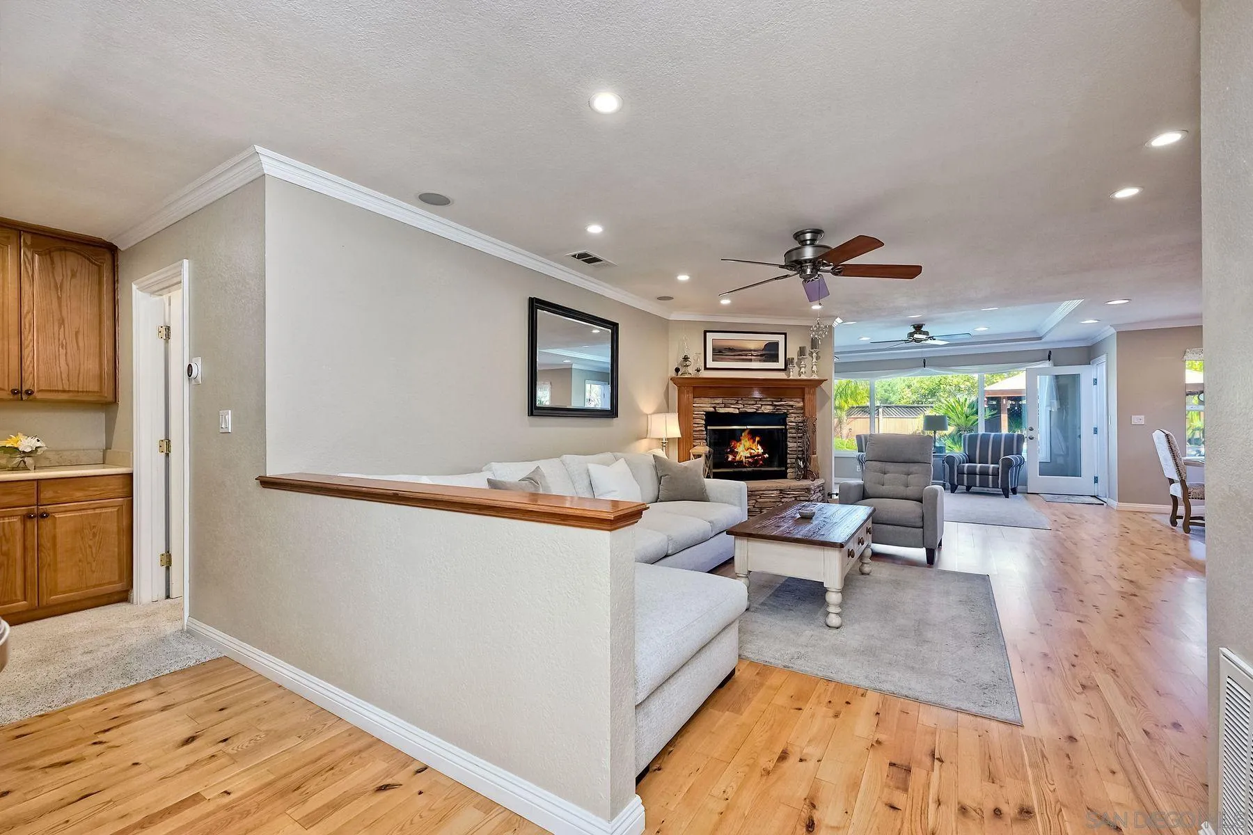 13821 Eisenhower Avenue Poway, CA 92064 - Photo 8 of 37 a living room with furniture and a wooden floor