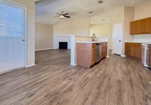 a kitchen with a sink stove top oven and microwave