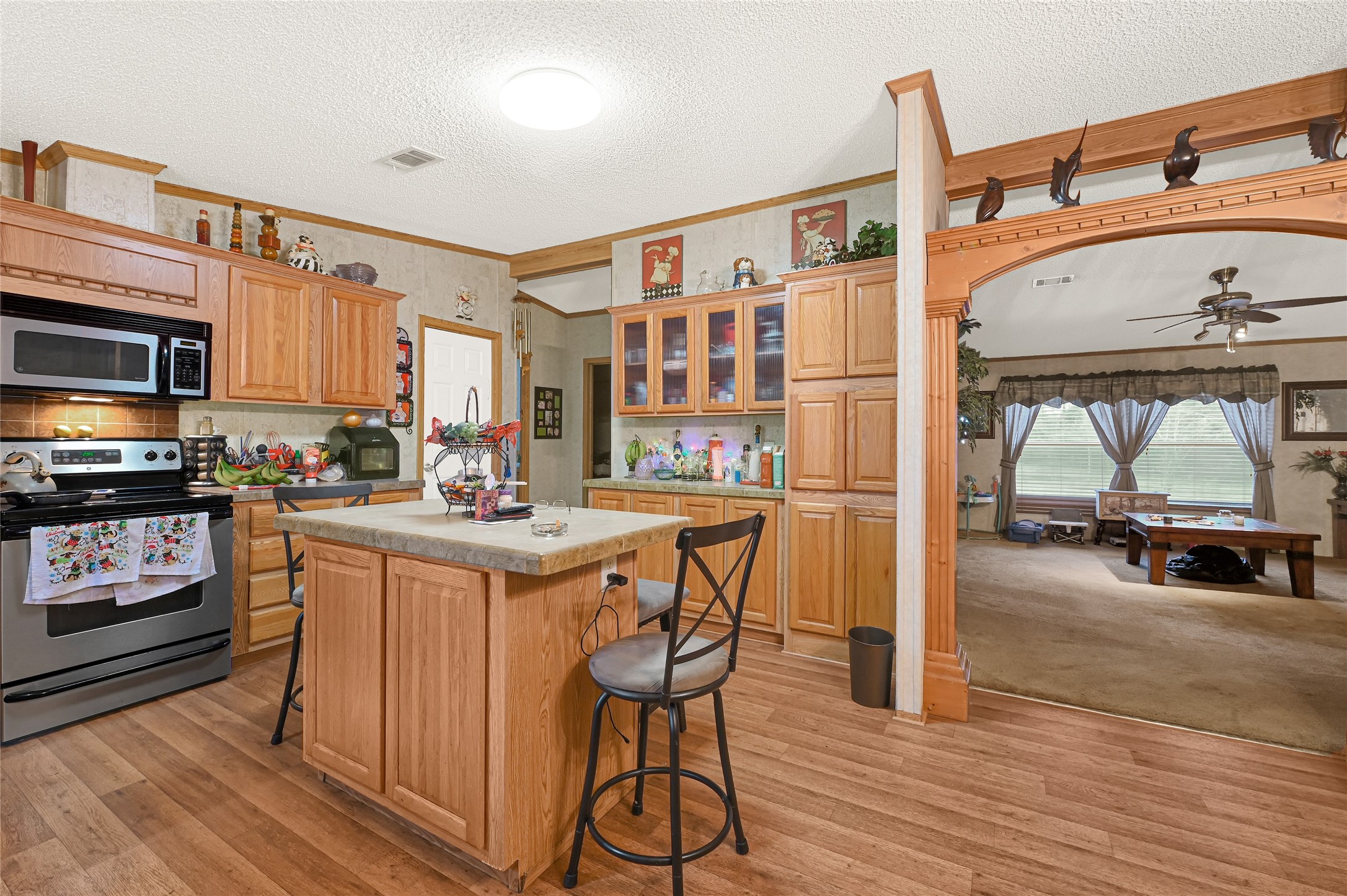 17106 Pickering Road Conroe, TX 77302 - Photo 15 of 50 a kitchen with stainless steel appliances granite countertop a stove and a refrigerator