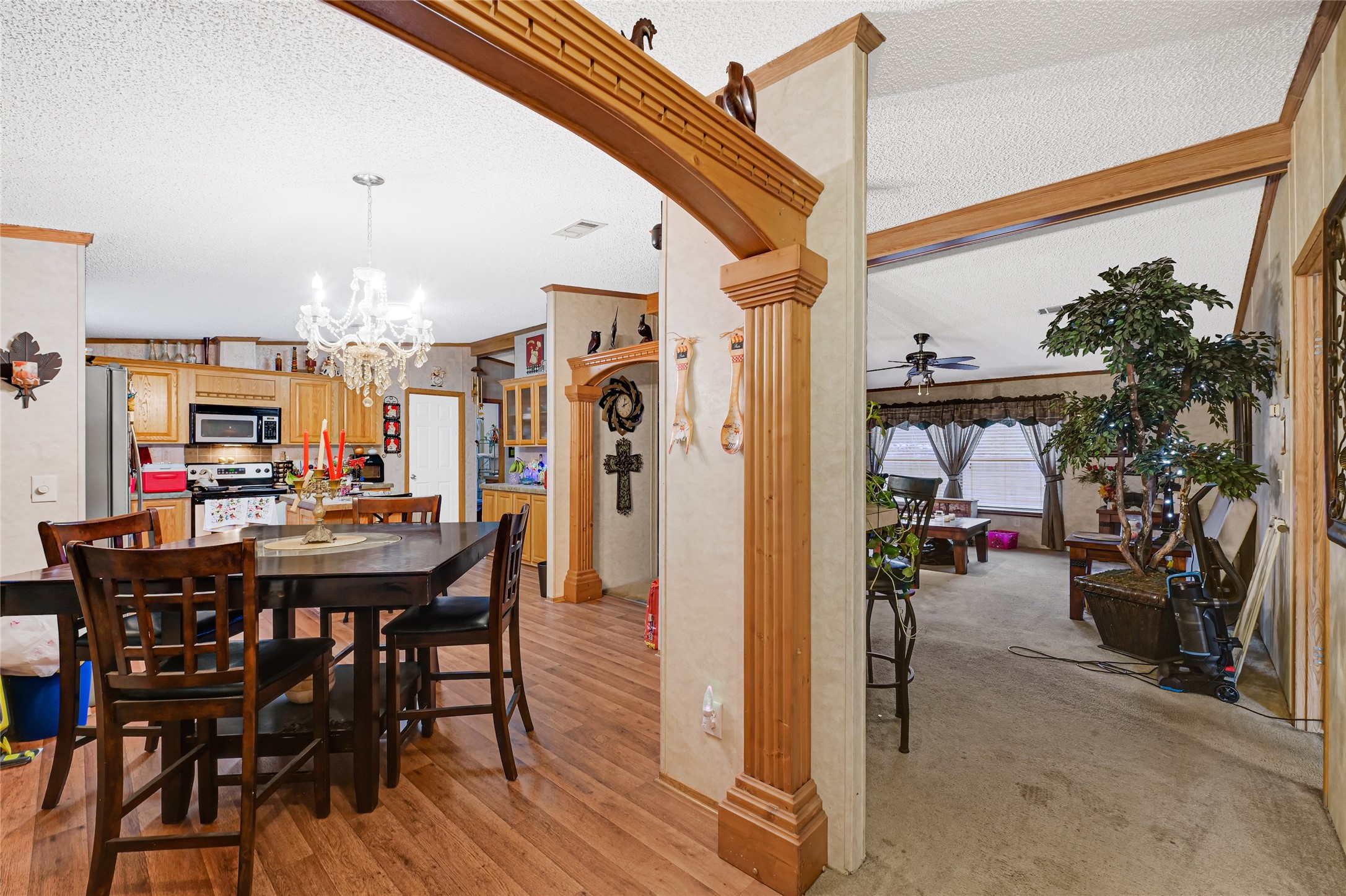 17106 Pickering Road Conroe, TX 77302 - Photo 20 of 50 a view of a dining room with furniture and a chandelier