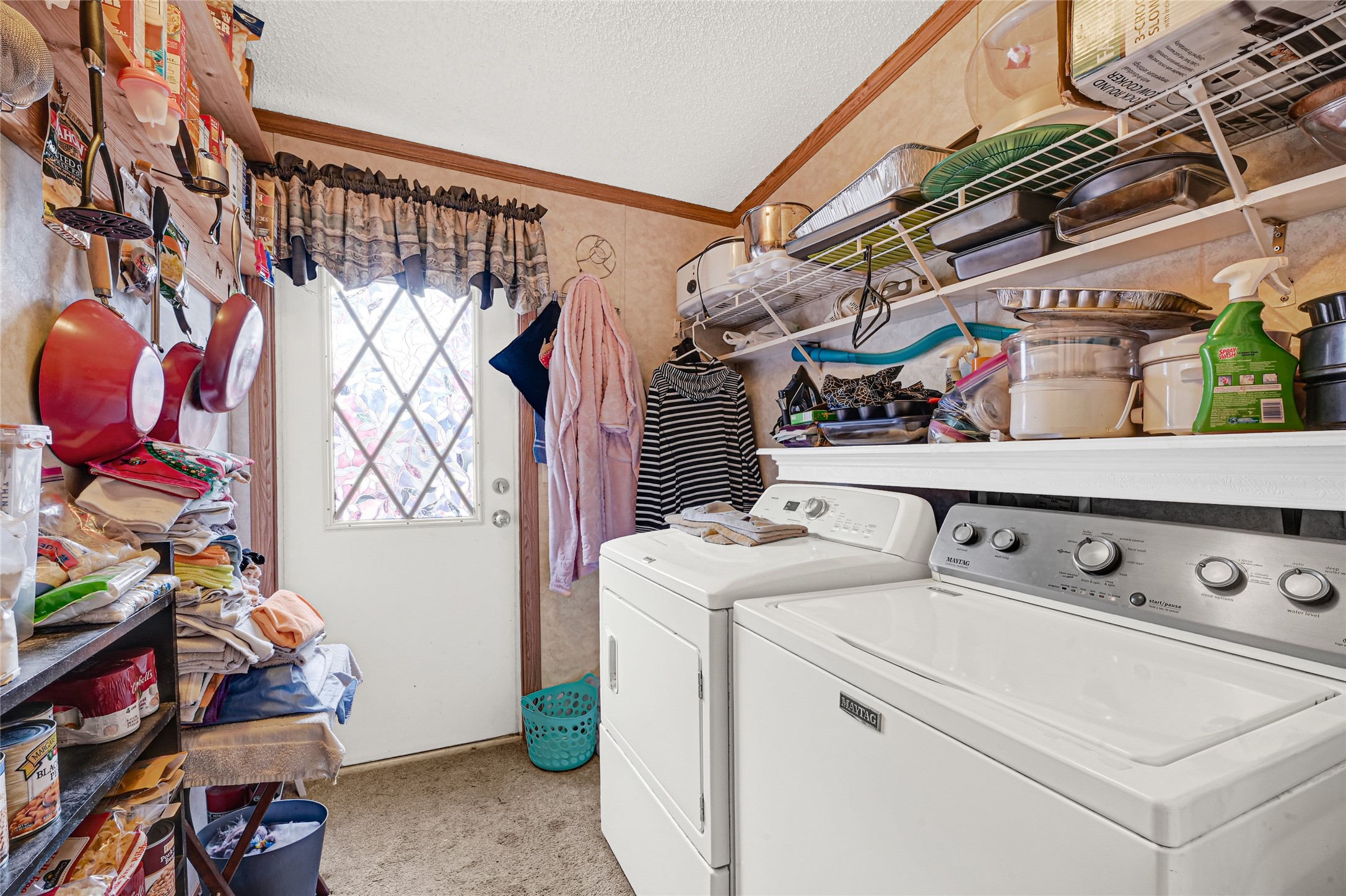 17106 Pickering Road Conroe, TX 77302 - Photo 23 of 50 Laundry area with storage shelving