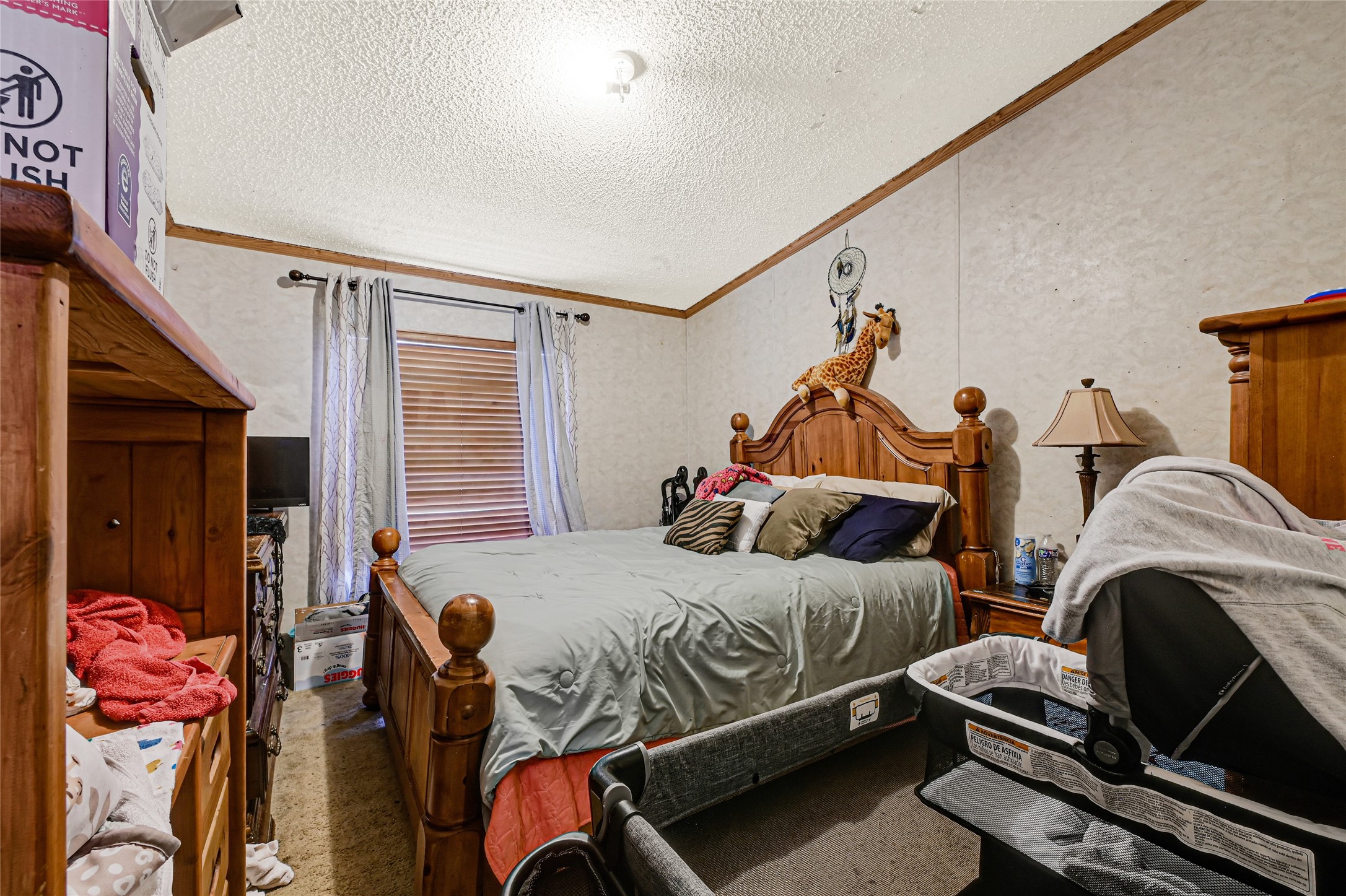 17106 Pickering Road Conroe, TX 77302 - Photo 26 of 50 a bedroom with two beds and a window