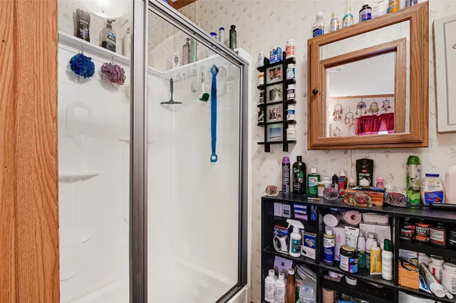 a view of a hallway with bathroom and bathroom