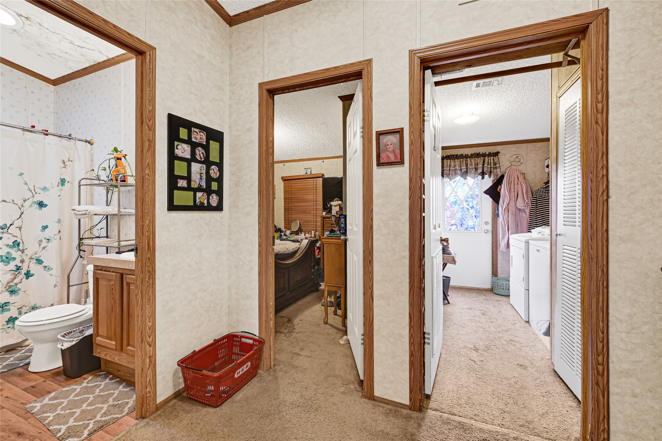 17106 Pickering Road Conroe, TX 77302 - Photo 28 of 50 a view of a hallway with bathroom and bathroom