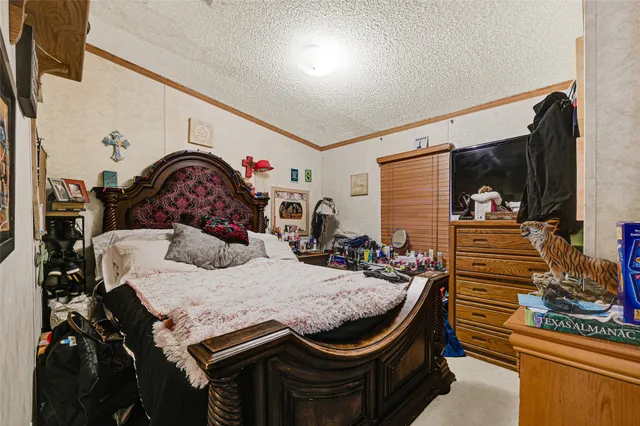 a bedroom with a bed and a closet