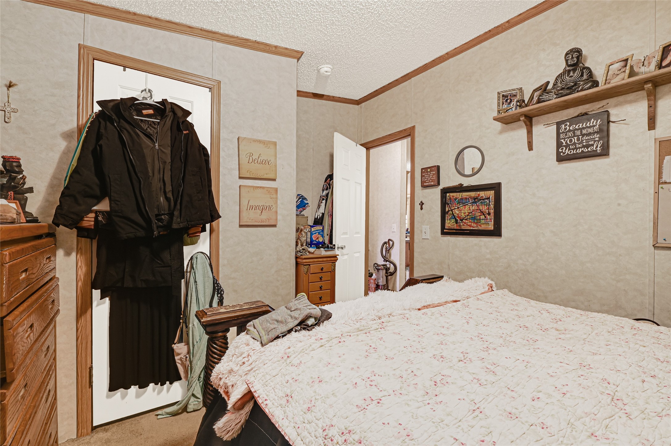 17106 Pickering Road Conroe, TX 77302 - Photo 32 of 50 a bedroom with a bed and a closet