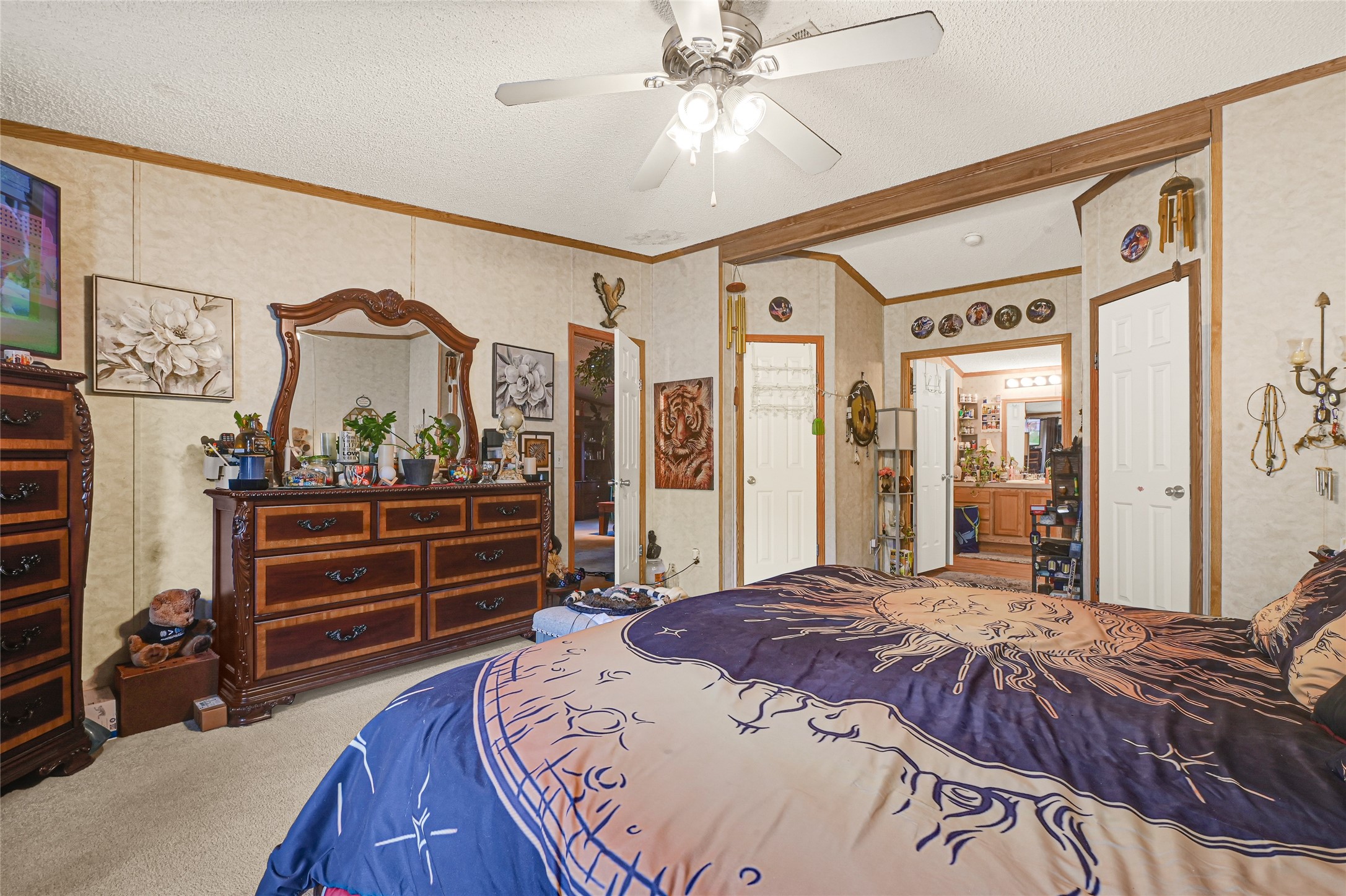 17106 Pickering Road Conroe, TX 77302 - Photo 37 of 50 a bedroom with a bed and a walk in closet