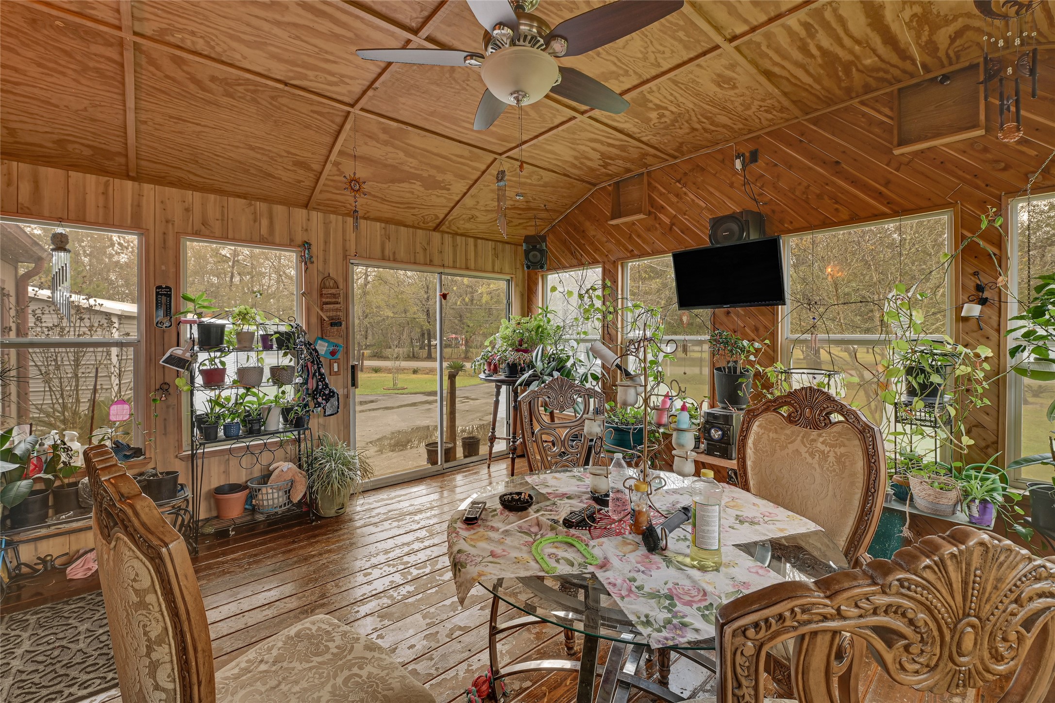 17106 Pickering Road Conroe, TX 77302 - Photo 40 of 50 a outdoor space with patio the couches and a potted plant