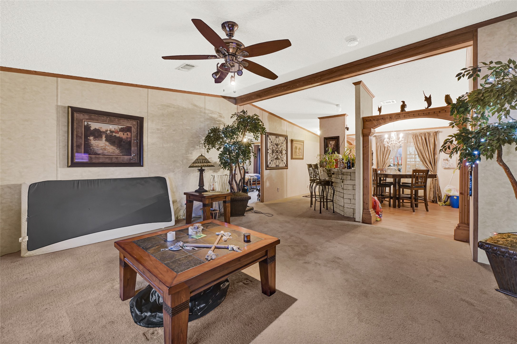 17106 Pickering Road Conroe, TX 77302 - Photo 7 of 50 a living room with furniture and a clock