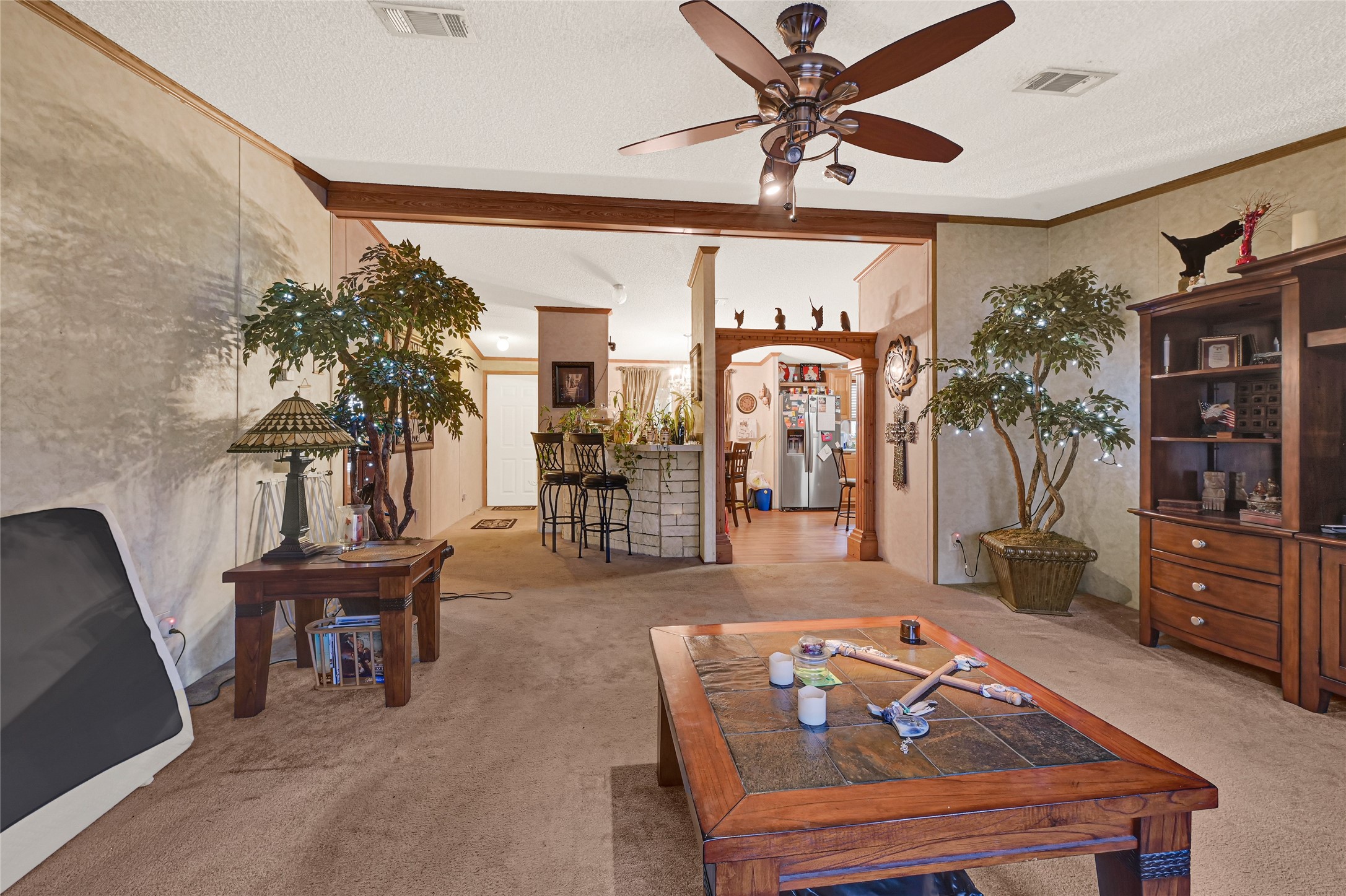 17106 Pickering Road Conroe, TX 77302 - Photo 8 of 50 a living room with furniture a chandelier and a dining table