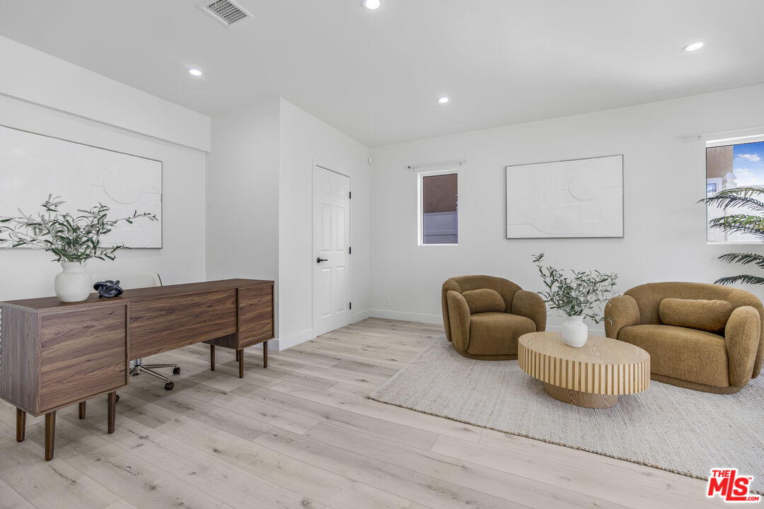 18202 Rancho Street Tarzana, CA 91356 - Photo 11 of 33 a living room with furniture and a potted plant