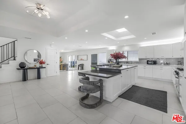 a kitchen with counter space cabinets and appliances