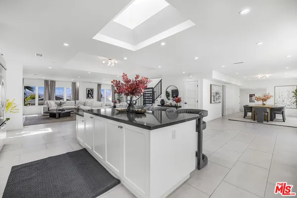 a kitchen with stainless steel appliances granite countertop a sink and cabinets