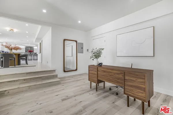 a room with furniture and wooden floor