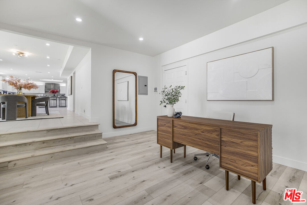 18202 Rancho Street Tarzana, CA 91356 - Photo 21 of 33 a room with furniture and wooden floor