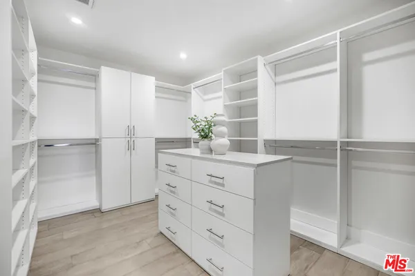 a bathroom with a shower and a sink