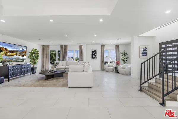 a living room with furniture and a couch