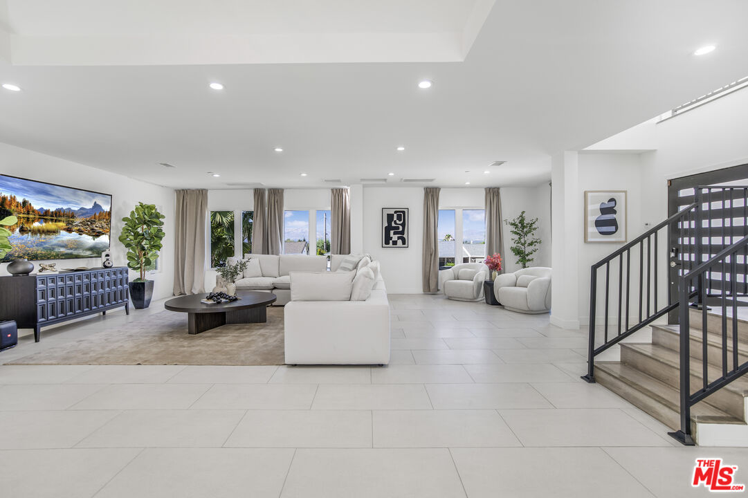 18202 Rancho Street Tarzana, CA 91356 - Photo 8 of 33 a living room with furniture and a couch