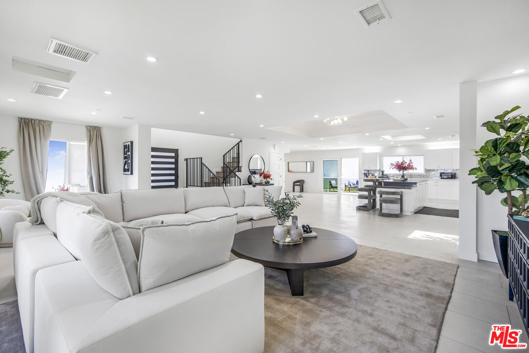 18202 Rancho Street Tarzana, CA 91356 - Photo 9 of 33 a living room with furniture and a table