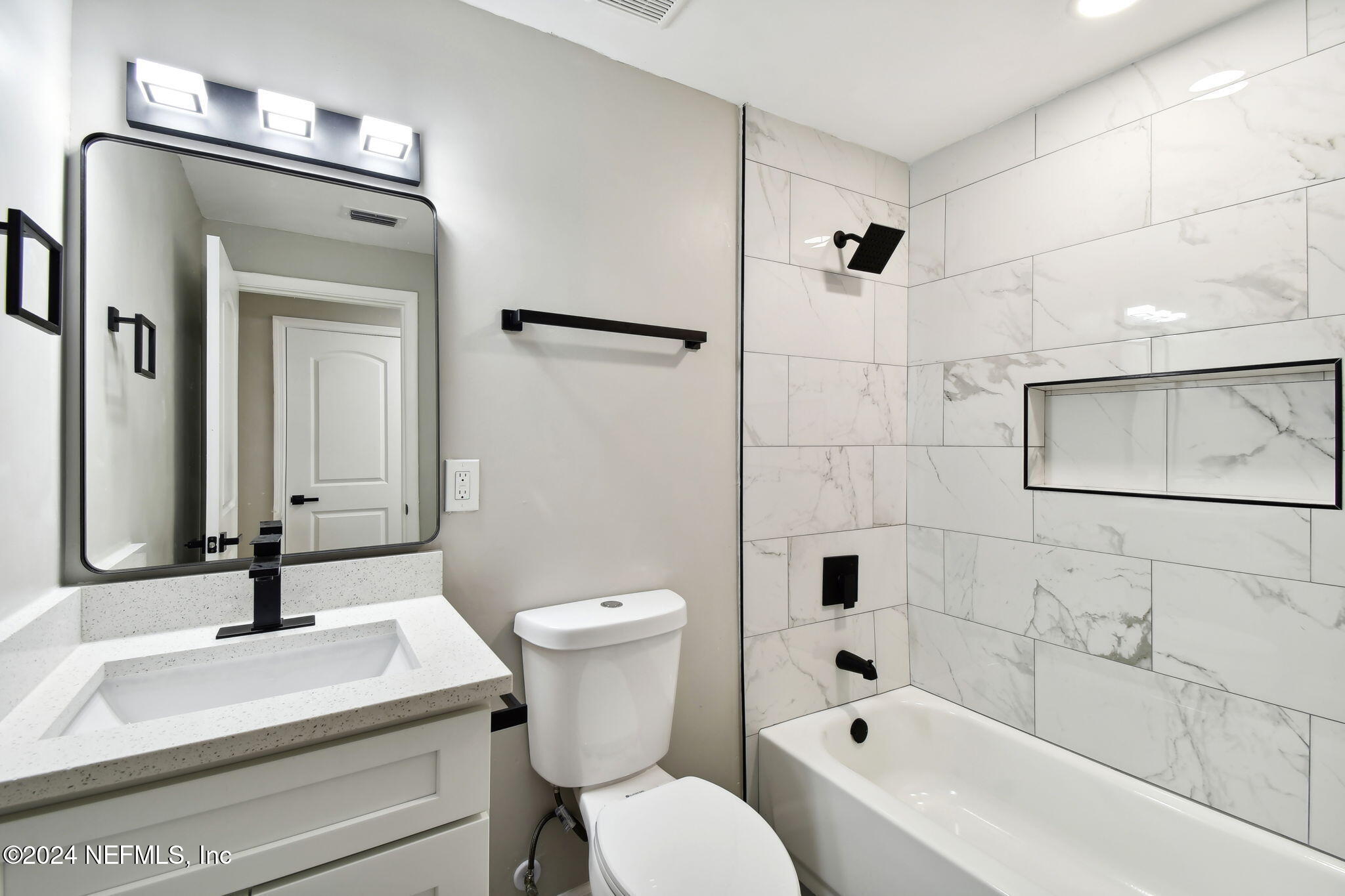 7518 Pinnacle Drive Jacksonville, FL 32221 - Photo 21 of 28 a bathroom with a sink a toilet and shower