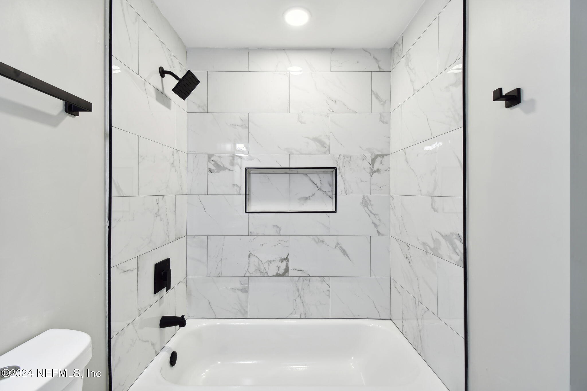 7518 Pinnacle Drive Jacksonville, FL 32221 - Photo 22 of 28 a bathroom with a bathtub and shower