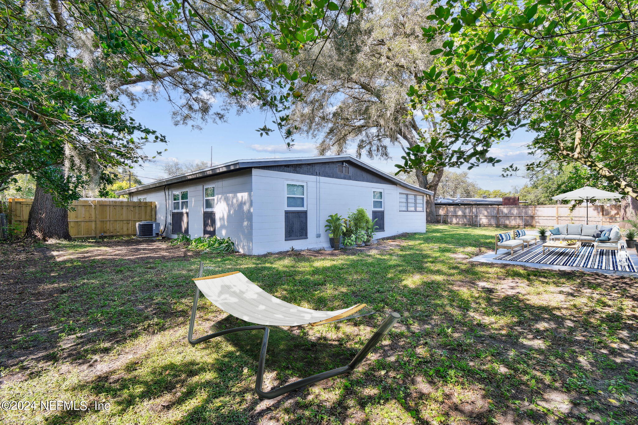7518 Pinnacle Drive Jacksonville, FL 32221 - Photo 27 of 28 a view of a house with a yard porch and sitting area