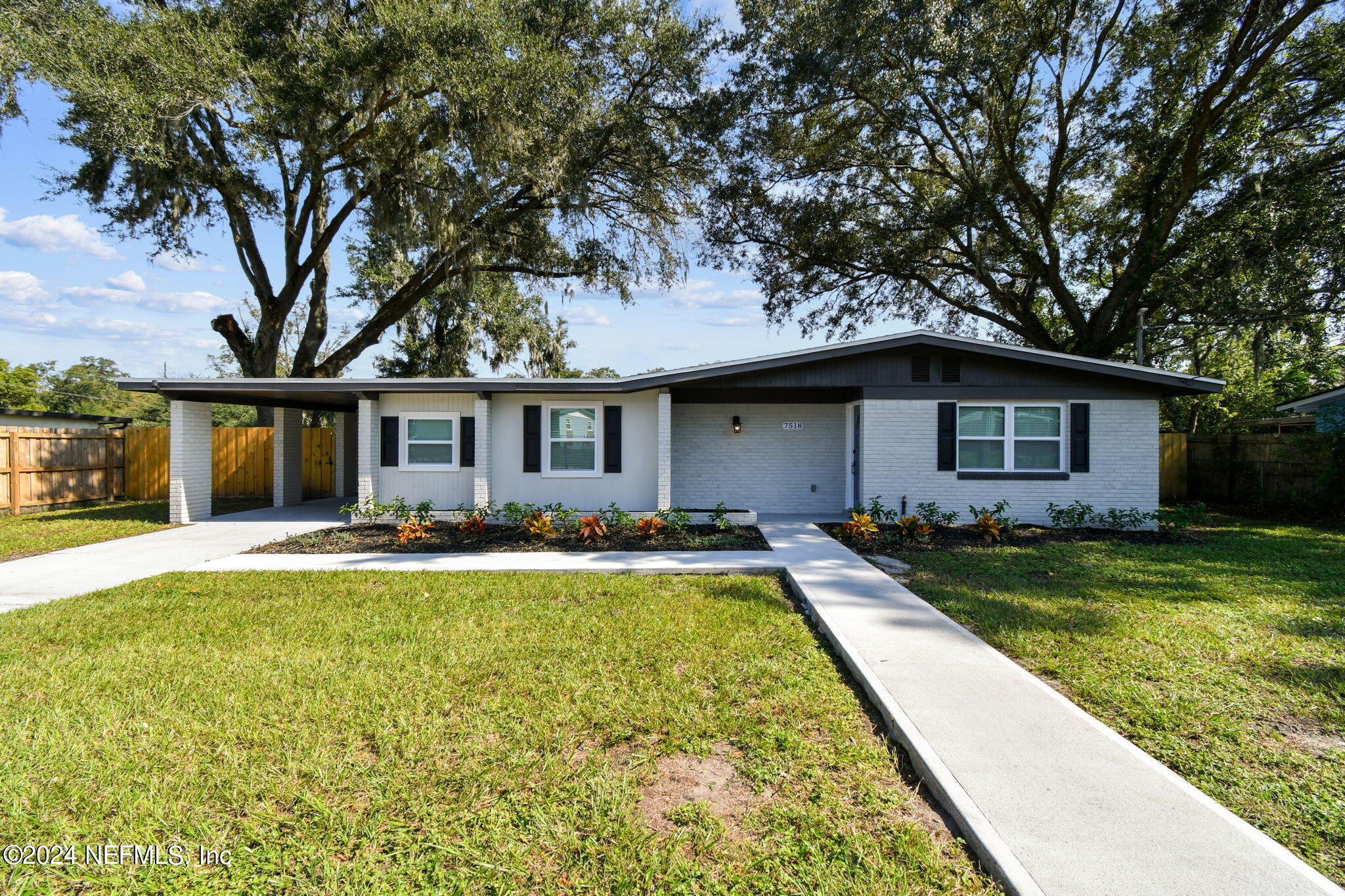 7518 Pinnacle Drive Jacksonville, FL 32221 - Photo 3 of 28 front view of a house with swimming pool