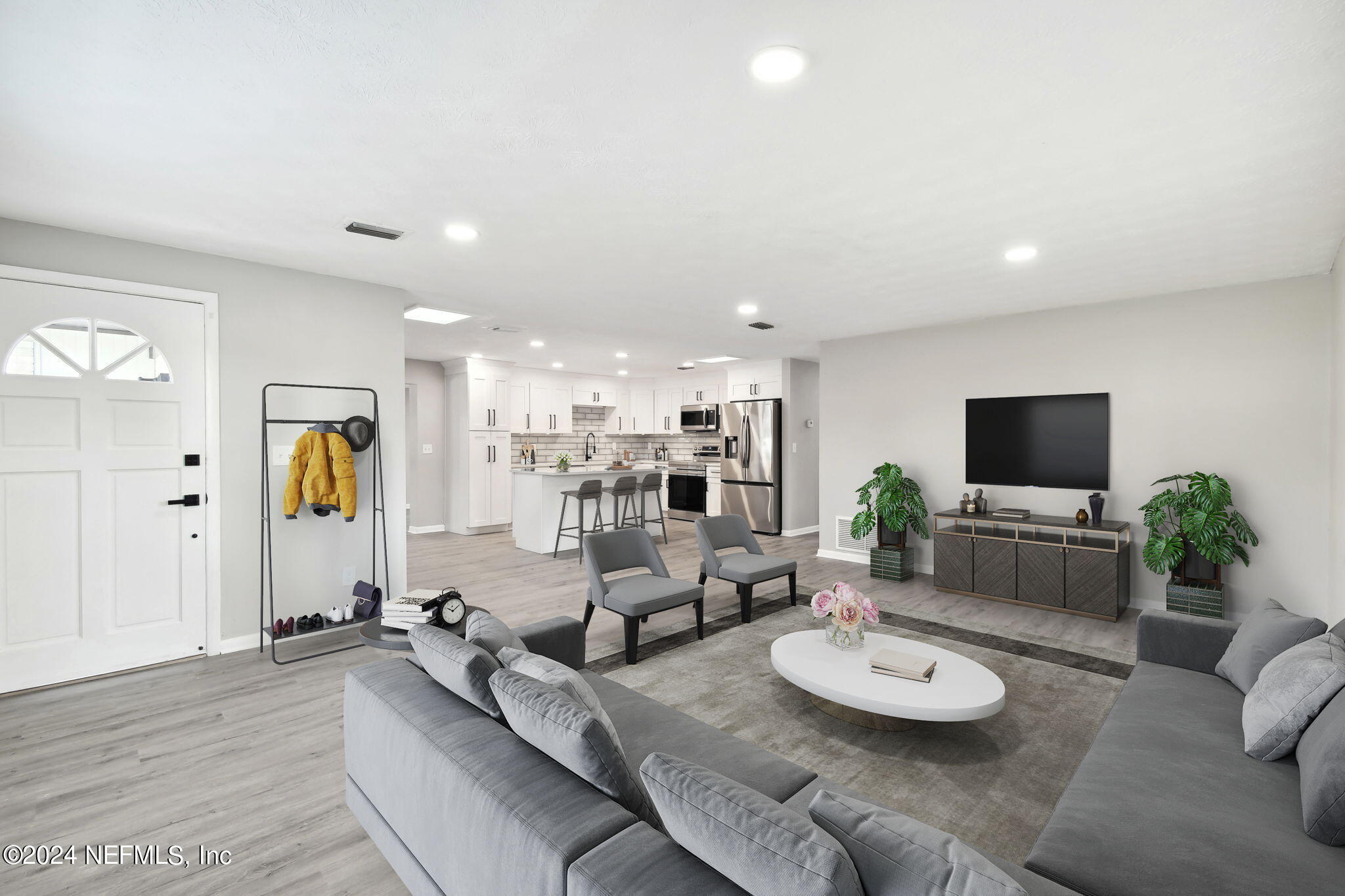 7518 Pinnacle Drive Jacksonville, FL 32221 - Photo 4 of 28 a living room with furniture and a flat screen tv