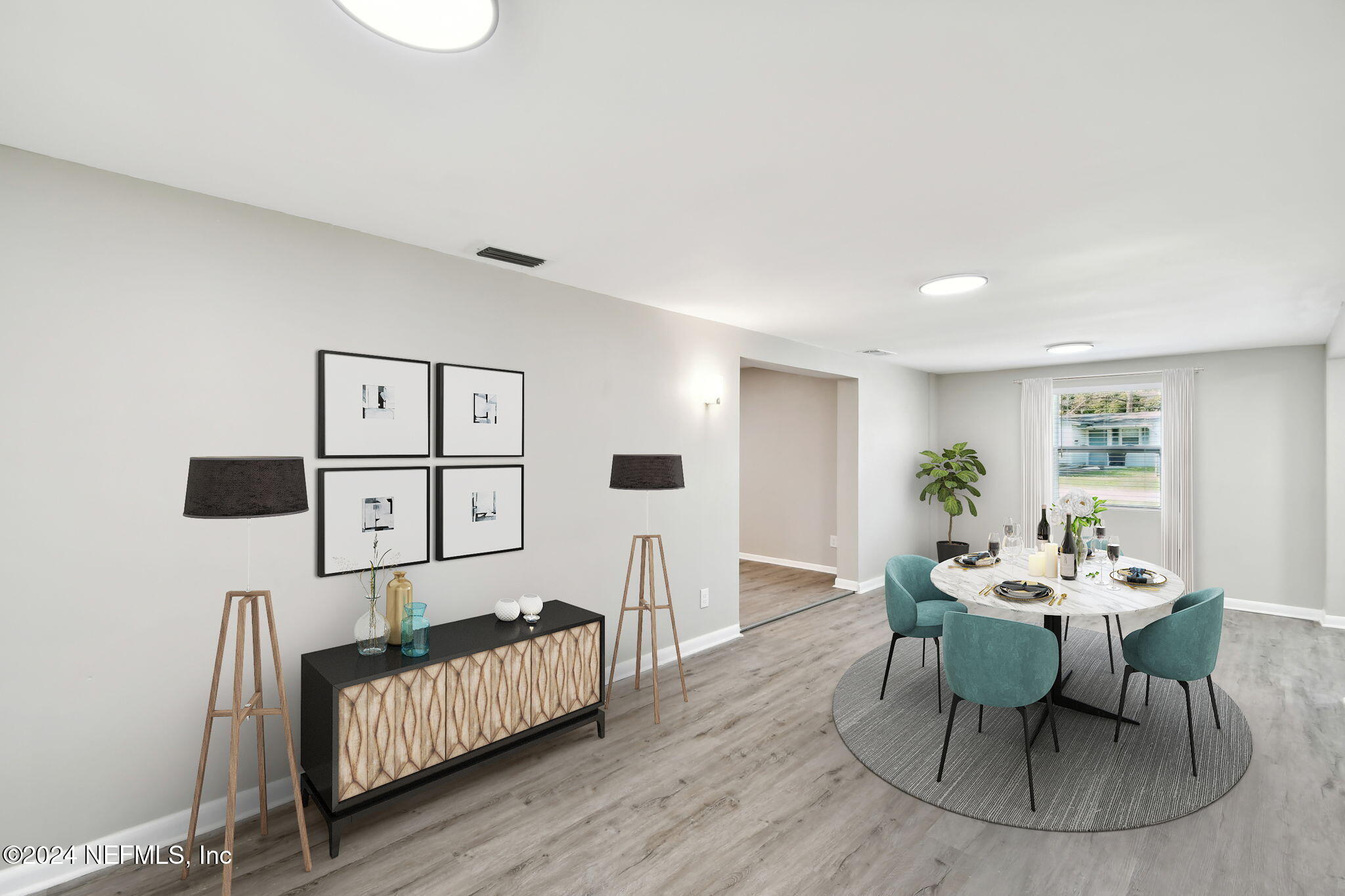 7518 Pinnacle Drive Jacksonville, FL 32221 - Photo 10 of 28 a dining room with furniture and wooden floor