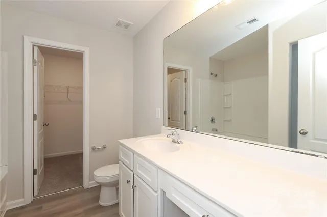 a bathroom with a bathtub and a toilet