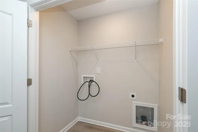 a view of an empty room with a flat screen tv