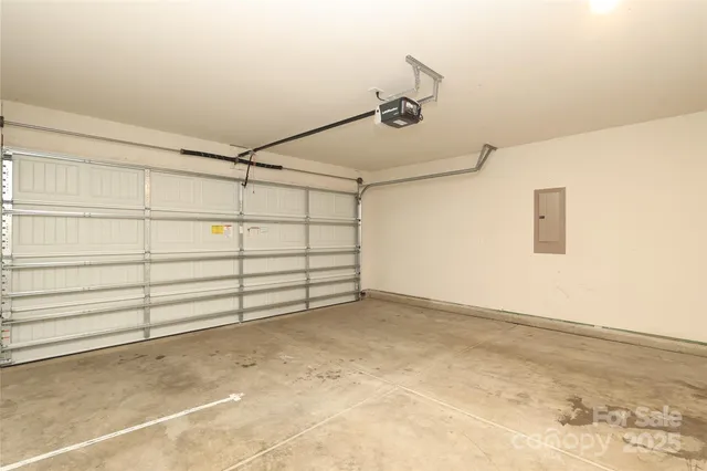 a view of a field with trees in the background