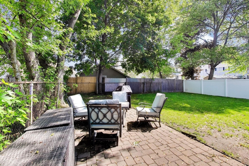 22 Douglas Road Ashland, MA 01721 - Photo 23 of 24 a view of backyard with seating and green space