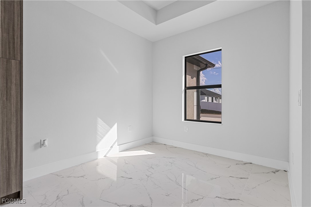 3728 9th Street West Lehigh Acres, FL 33971 - Photo 14 of 35 an empty room with windows and closet