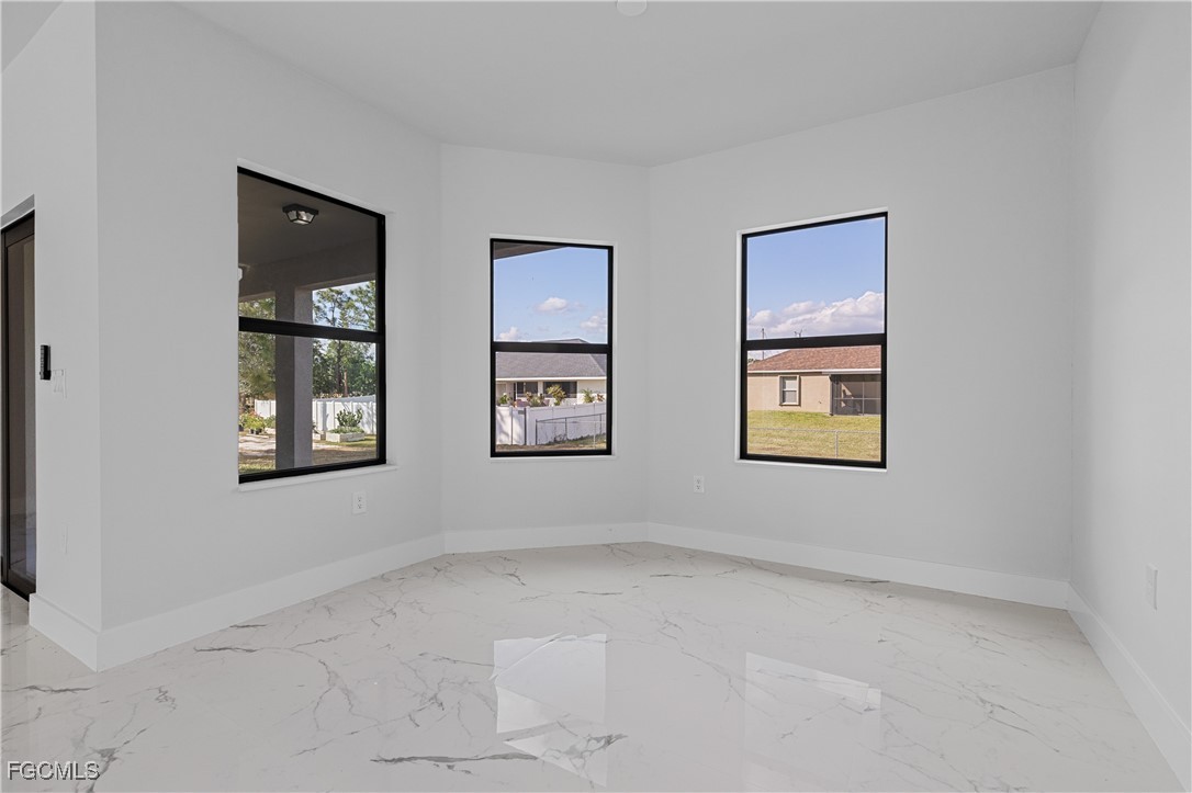 3728 9th Street West Lehigh Acres, FL 33971 - Photo 15 of 35 a view of room with window and ceiling fan