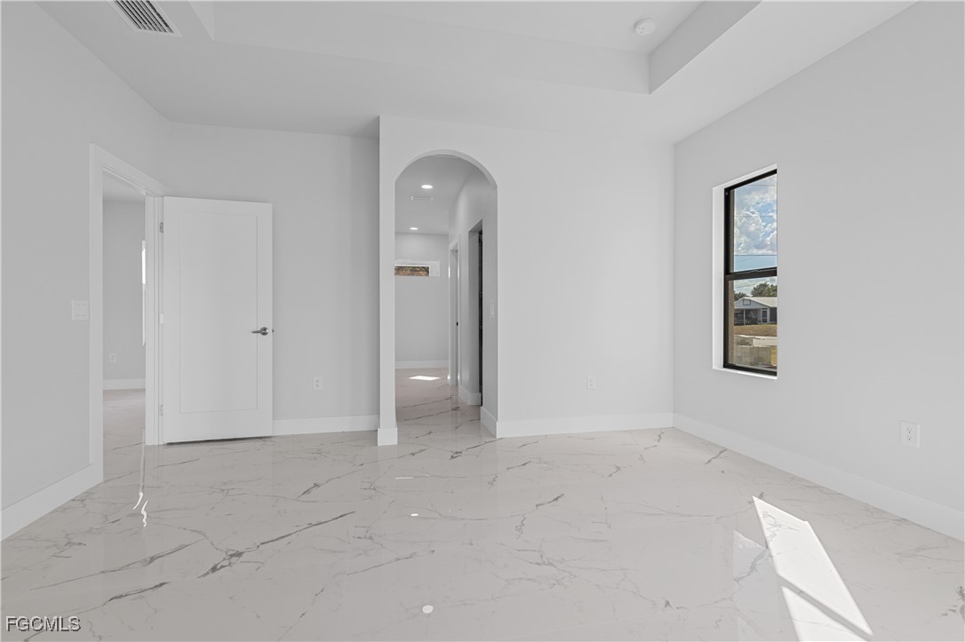 3728 9th Street West Lehigh Acres, FL 33971 - Photo 17 of 35 an empty room with windows