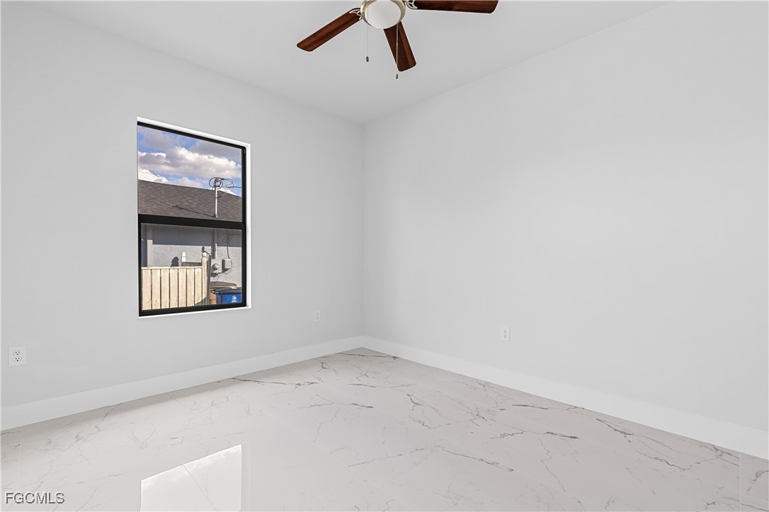 3728 9th Street West Lehigh Acres, FL 33971 - Photo 22 of 35 an empty room with a window